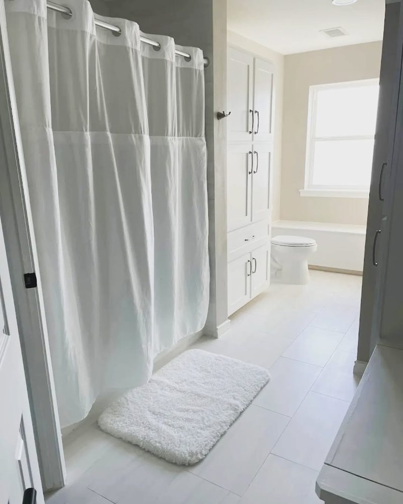 A bathroom remodel with a custom vanity